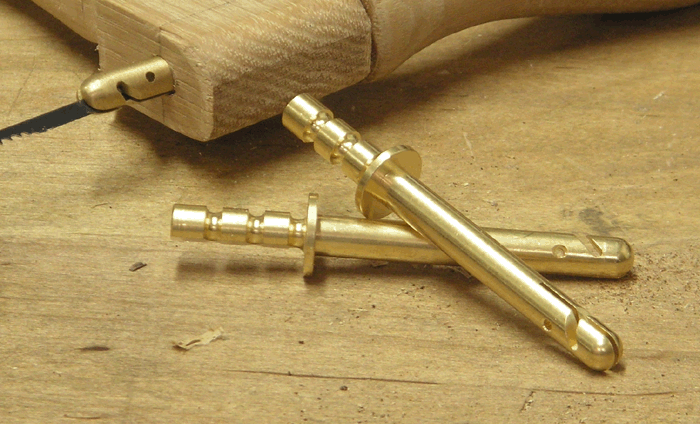 Closeup of bowsaw pins
